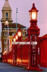 ID 1886 PORT OF AUCKLAND, NZ - Running the length of Quay Street, the famous red fence separates the port estate from downtown Auckland's commercial heart. It was erected during the infamous waterfront strike...
